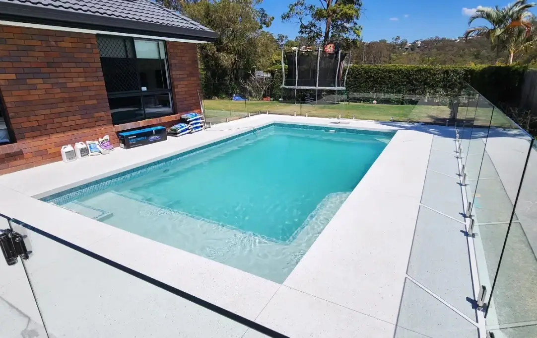 concrete pool building and pool area landscaping with pool fence installation Robina concrete pool building and pool area landscaping with pool fence installation Robina