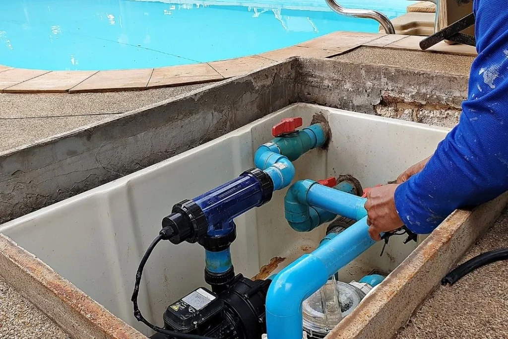 Pool technician repairing pump