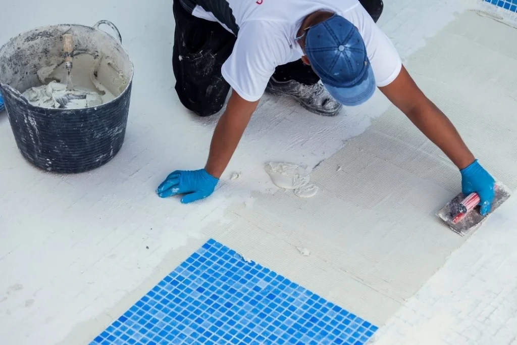 Worker tiling the pool