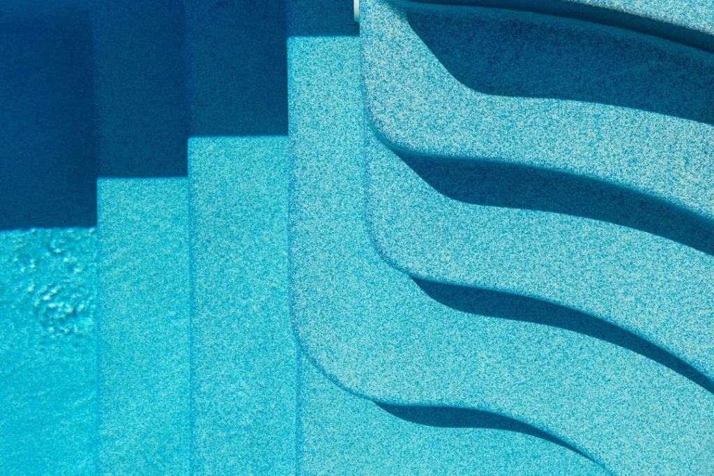 pool stairs with pebblecrete finish
